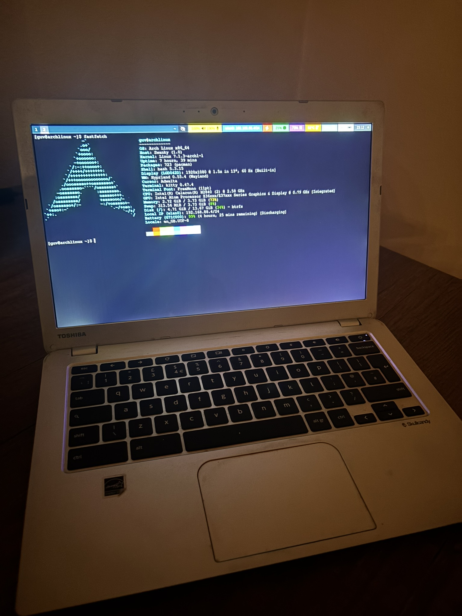 The Toshiba Chromebook 2 running Arch Linux and Hyprland, with fastfetch open in a terminal.